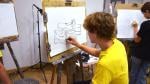 Teen drawing at easel