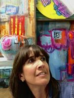 woman+smiling+in+front+of+painting